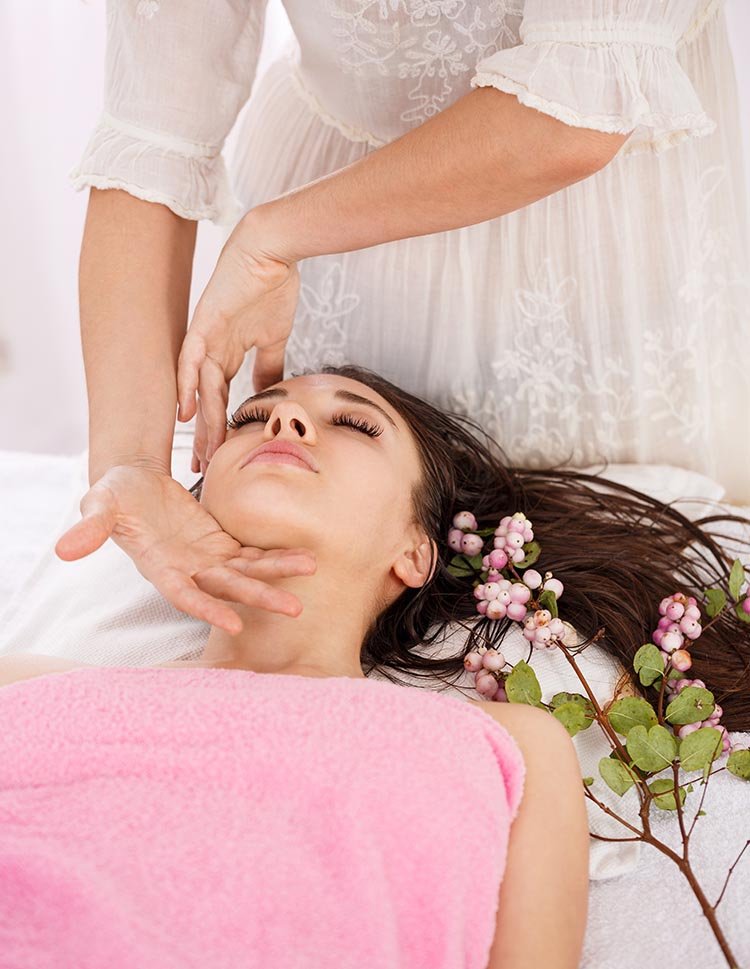 closeup female masseur hands doing facial massage carefully